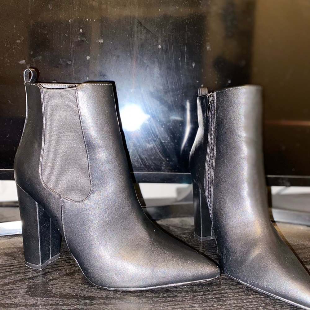 Black heeled leather booties